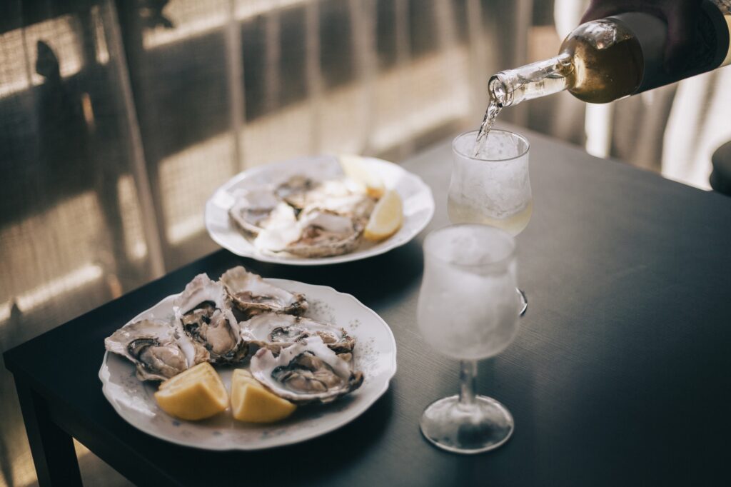 Homemade summer meal, oysters and wine at home