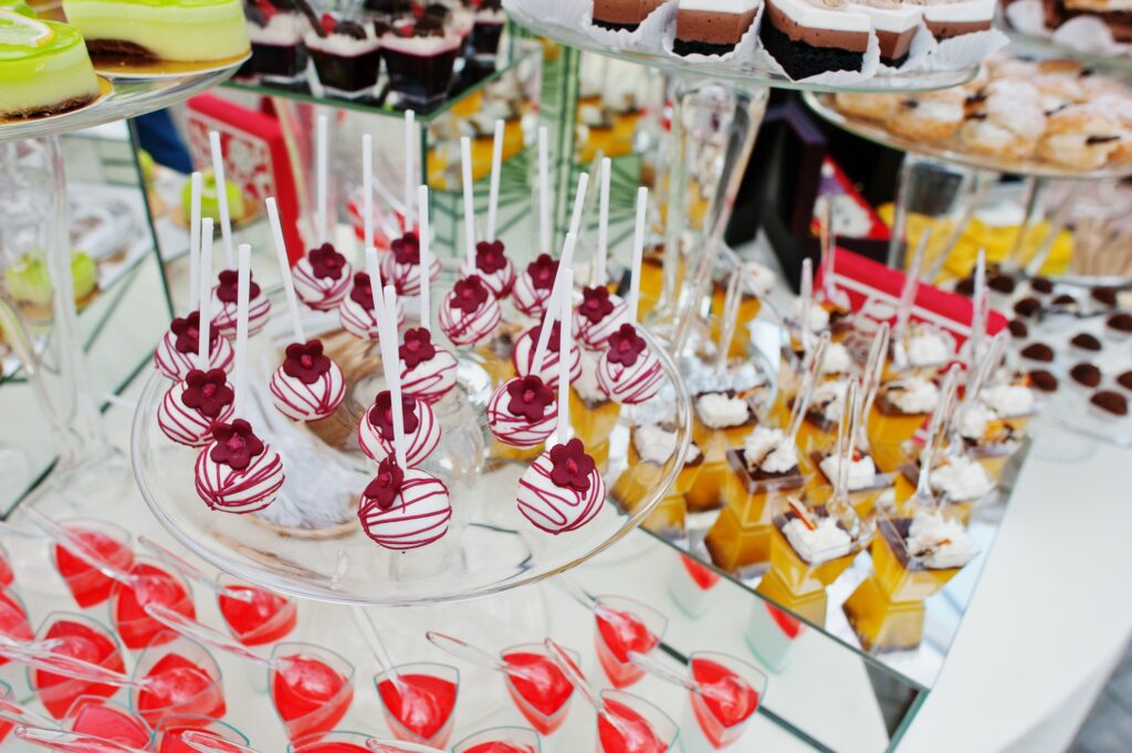 Wedding catering table with different sweets and cakes.