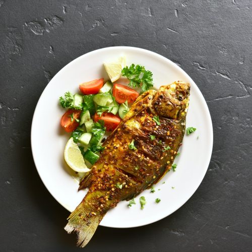Grilled fish with salad