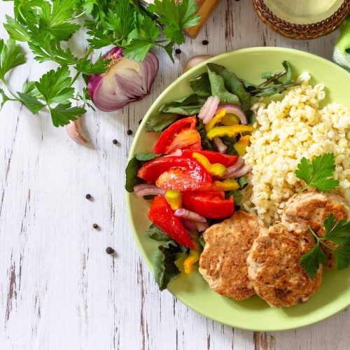 Healthy vegan food, keto or paleo diets. Homemade red fish cutlets with bulgur.
